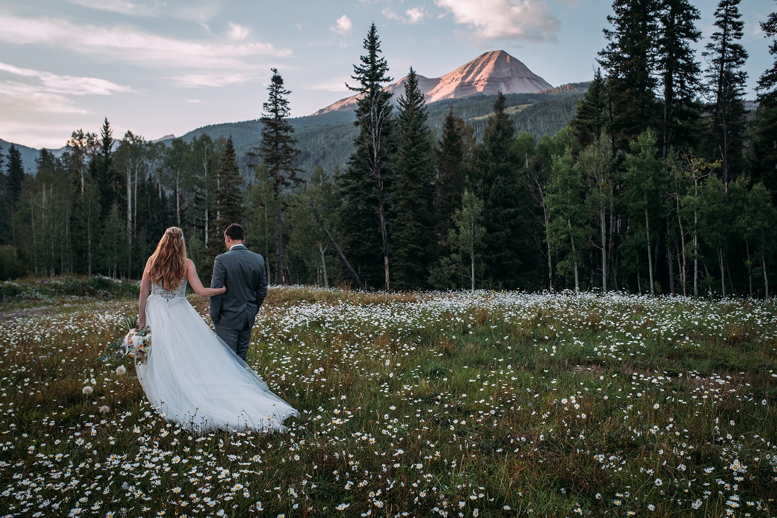 Intimate mountain wedding in Colorado with mountain backdrop